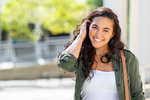 Young graduate smiling in camera